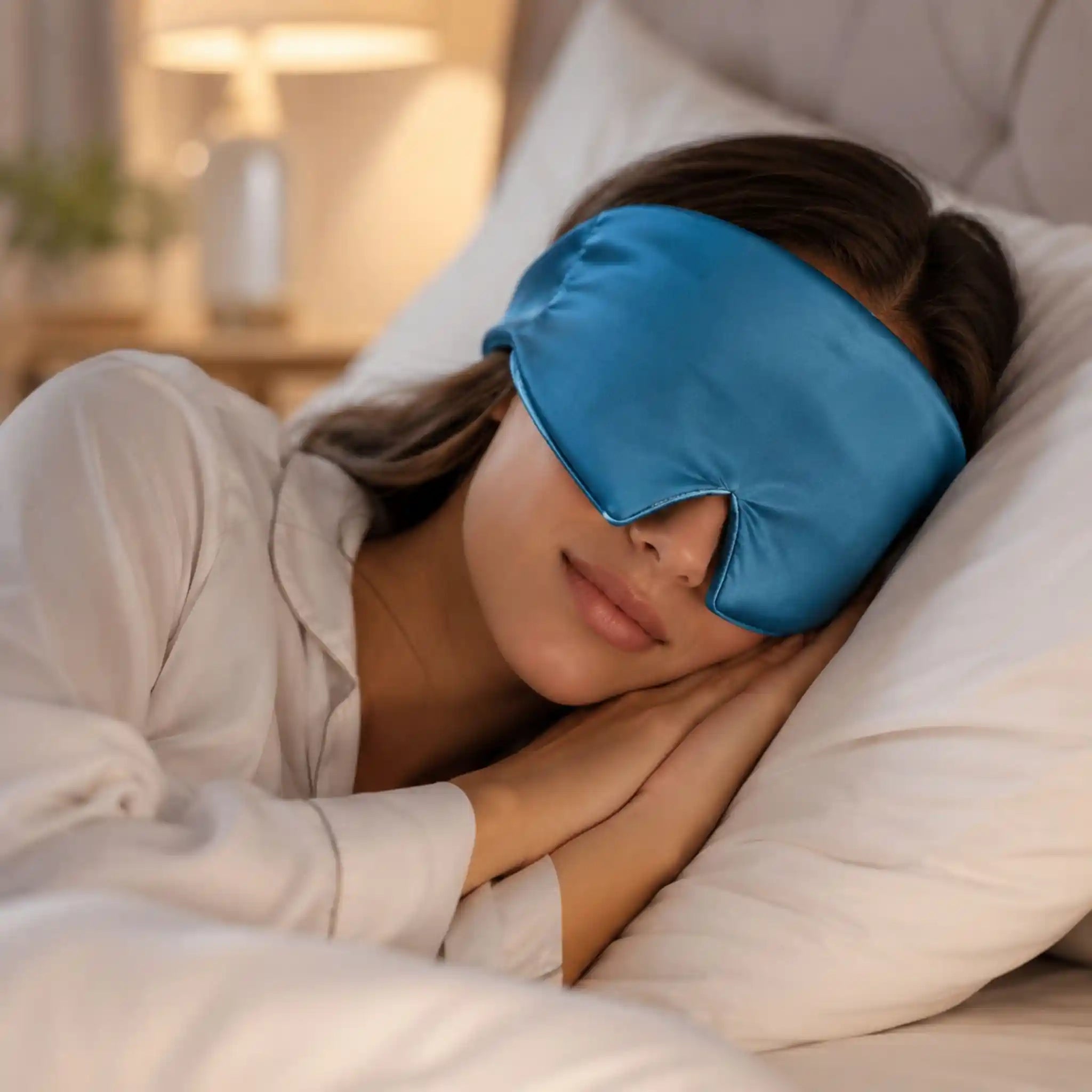A professional using the RelievoCare Silk Recovery Sleep Mask for a relaxing midday meditation break at work.